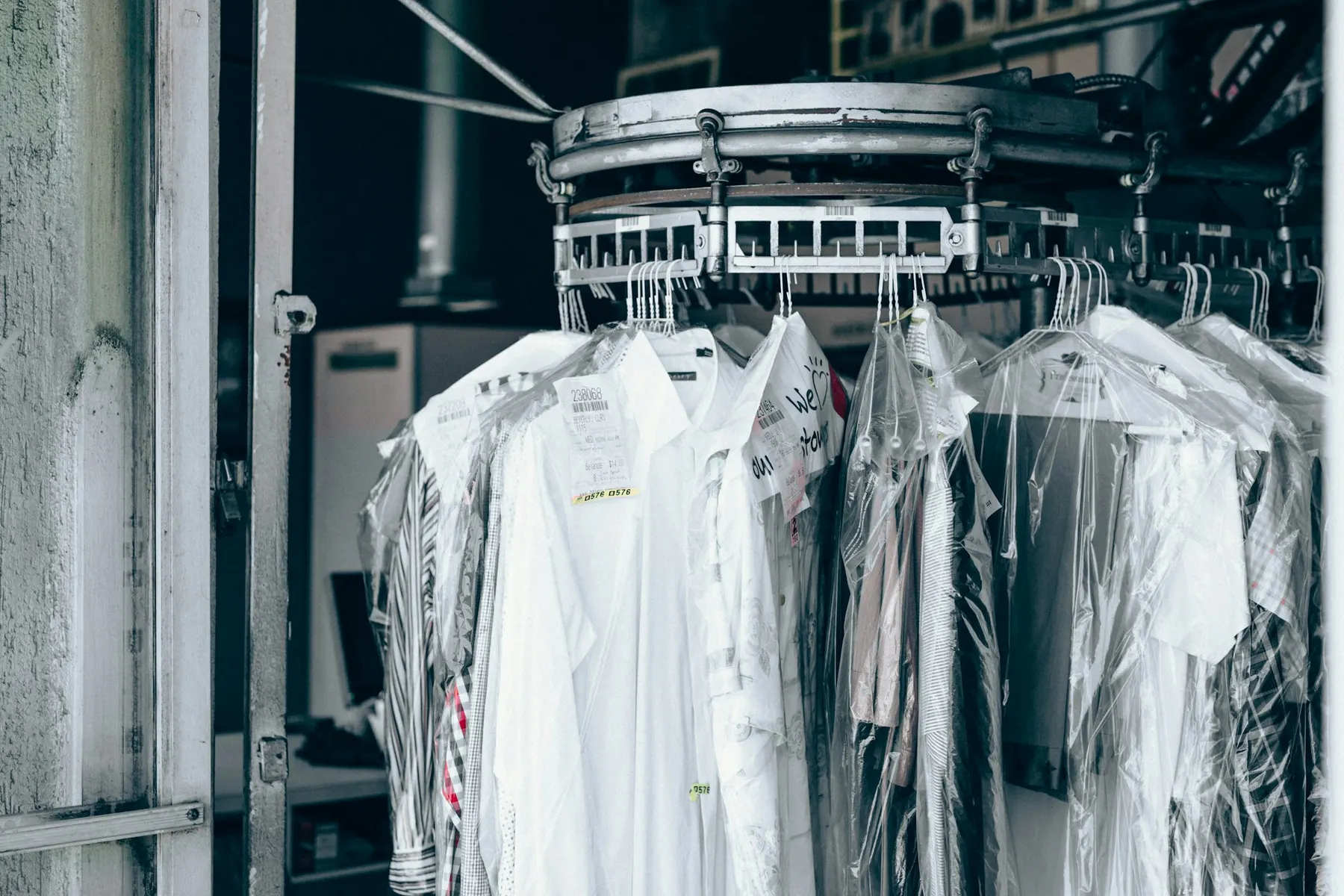 Freshly dry-cleaned shirts in protective covers