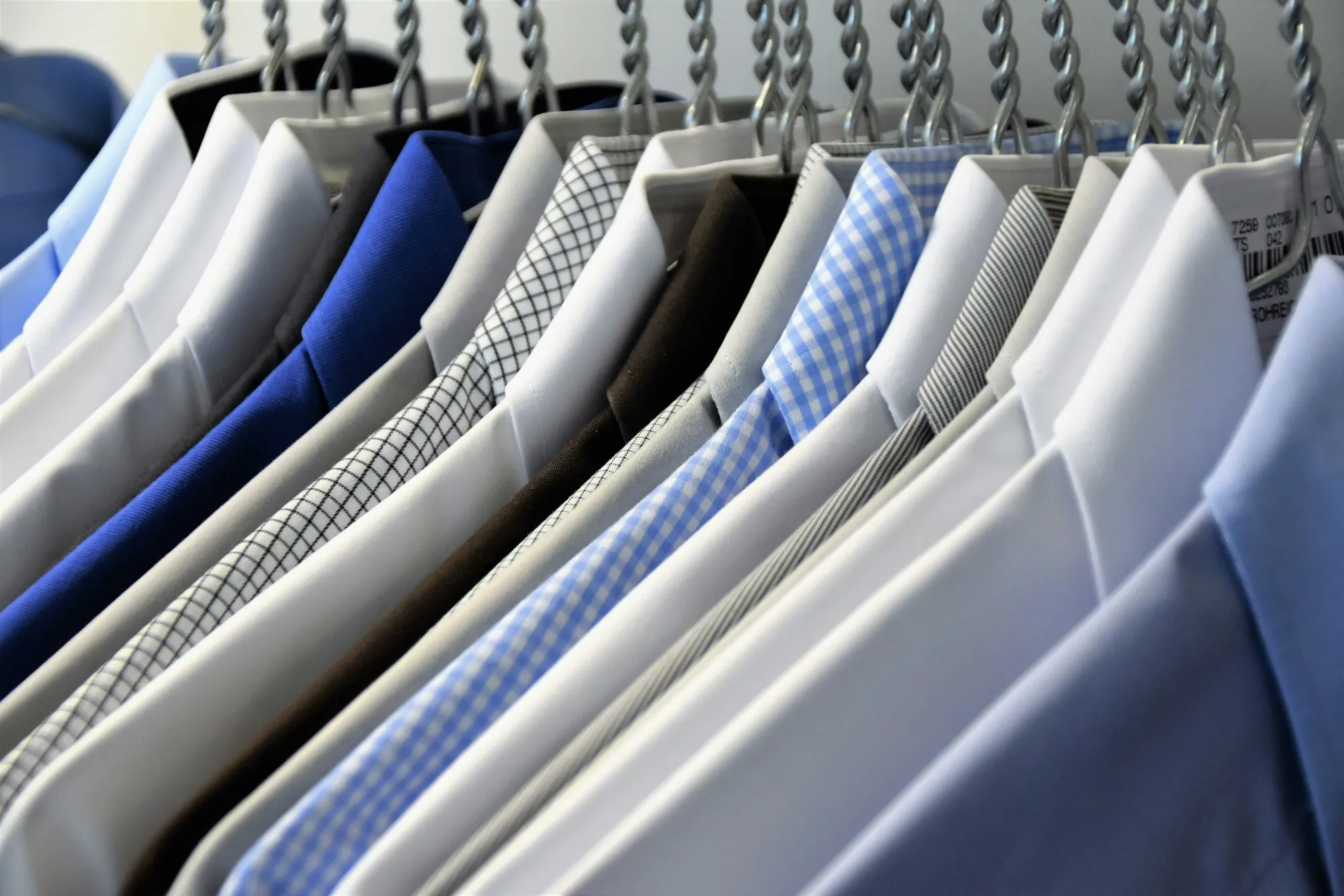 Crisp, freshly pressed dress shirts on hangers